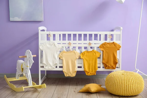 Interior Stylish Children Bedroom Crib Baby Bodysuits — Stock Photo, Image