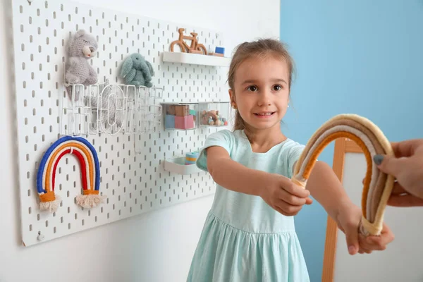 Cute Little Girl Toy Rainbow Hanging Peg Board Light Wall — Stock Photo, Image