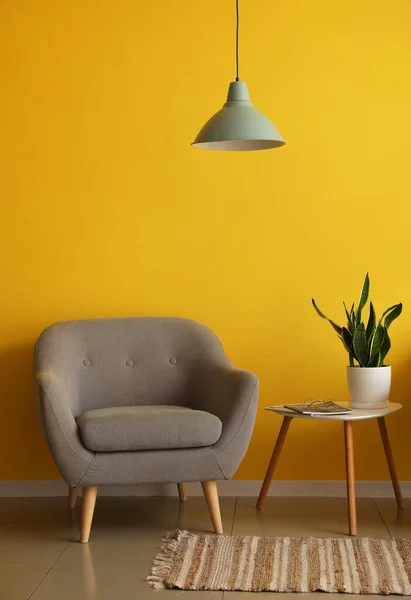 Comfortable Armchair Table Lamp Hanging Yellow Wall — Stock Photo, Image