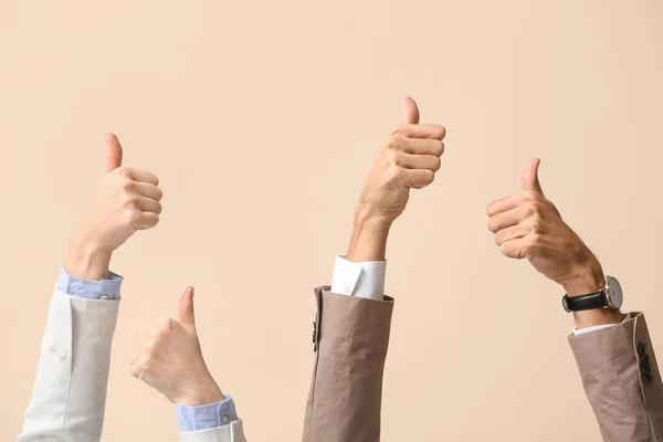 Business Workers Showing Thumbs Beige Background — Stock Photo, Image