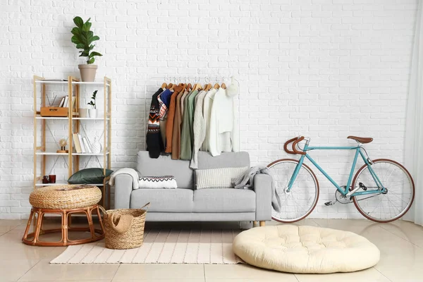 Interior Living Room Comfortable Sofa Rack Stylish Sweaters White Brick — Stock Photo, Image