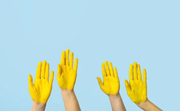 Many Hands Painted Yellow Palms Blue Background — Stock Photo, Image