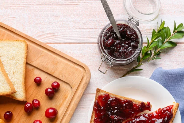 Jar Tasty Lingonberry Jam Toasts Light Wooden Background — Stock Photo, Image