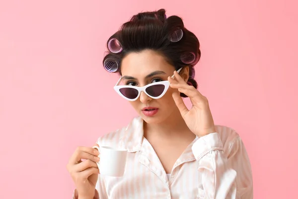 Beautiful Young Woman Pajamas Hair Curlers Sunglasses Drinking Coffee Pink — Stock Photo, Image