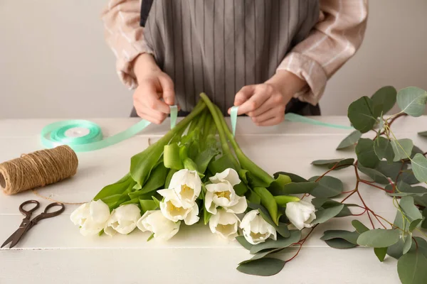 Female Florist Making Bouquet Beautiful Tulip Flowers Light Wooden Table — Stock Photo, Image