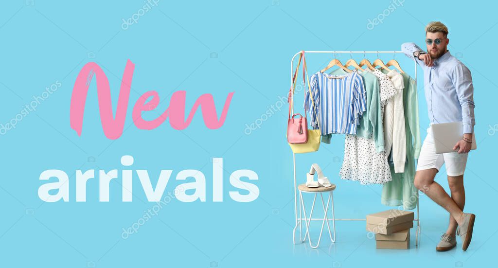 Male stylist near rack with modern clothes and text NEW ARRIVALS on blue background