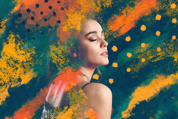 Portrait of young woman with colorful brush strokes on dark background