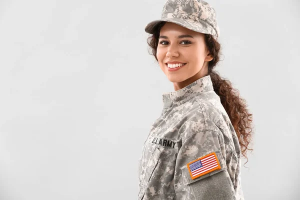 African American Female Soldier Light Background Stock Photo