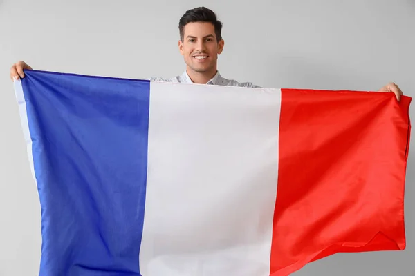 Joven Guapo Con Bandera Francia Sobre Fondo Claro —  Fotos de Stock
