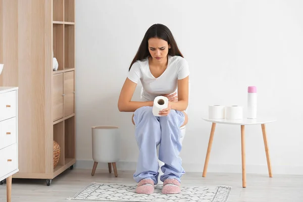 Sad Young Woman Paper Roll Sitting Toilet Bowl Restroom — Stock Photo, Image