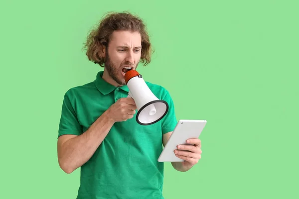 Angry Young Man Tablet Computer Shouting Megaphone Green Background — Stock Photo, Image