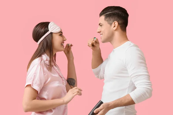 Young Couple Brushing Teeth Activated Charcoal Tooth Paste Pink Background — Stock Photo, Image
