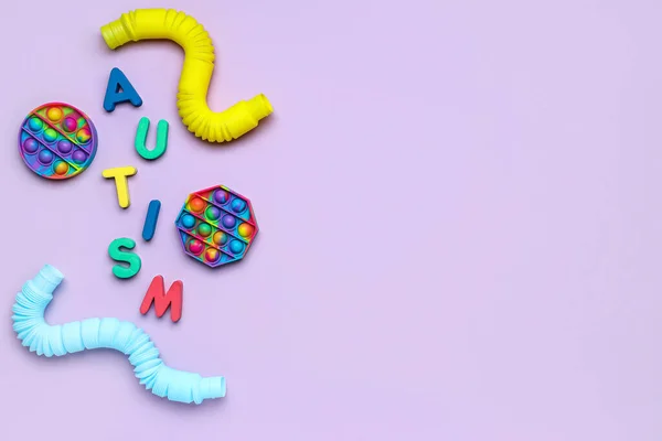 Word Autism Pop Fidget Zabawki Rurki Liliowym Tle — Zdjęcie stockowe