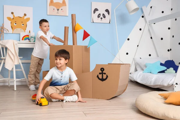 Funny Little Boys Playing Cardboard Ship Home — Stock Photo, Image