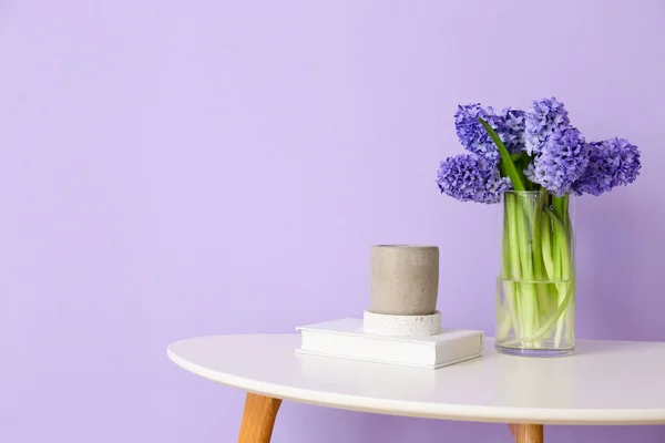 Vase Hyacinth Flowers Book Candle Table Color Wall — Stock Photo, Image