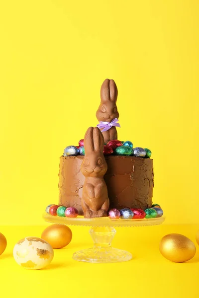 Tasty Easter Cake Decorated Chocolate Bunnies Painted Eggs Yellow Background — Stock Photo, Image