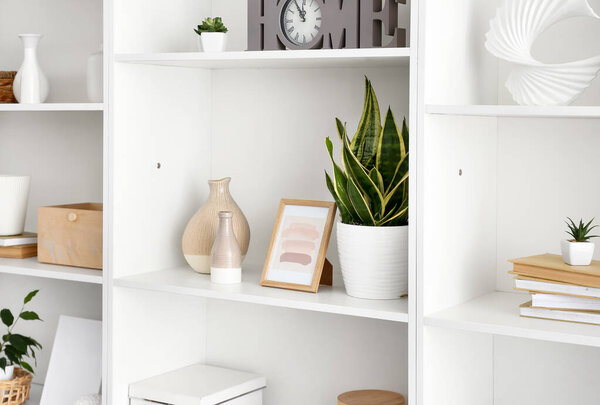 Shelf unit with beautiful decor in room