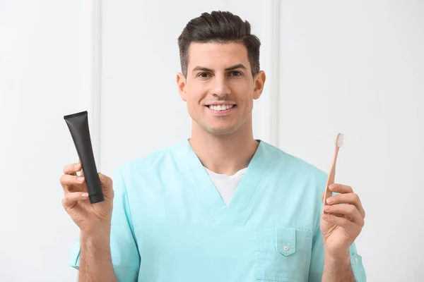 Male Dentist Activated Charcoal Tooth Paste Brush Light Background — Stock Photo, Image