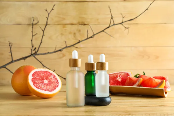 Bottles Healthy Grapefruit Essential Oil Wooden Background — Stock Photo, Image