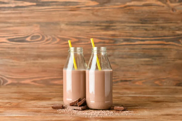 Láhve Lahodného Čokoládového Mléka Dřevěném Pozadí — Stock fotografie