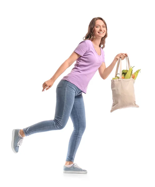 Mujer Joven Sosteniendo Bolsa Ecológica Con Verduras Saludables Sobre Fondo —  Fotos de Stock