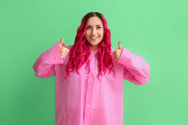 Beautiful Woman Raincoat Showing Thumb Color Background — Stock Photo, Image