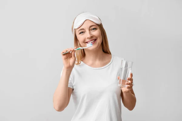 Beautiful Mature Woman Brushing Teeth Light Background — Stock Photo, Image