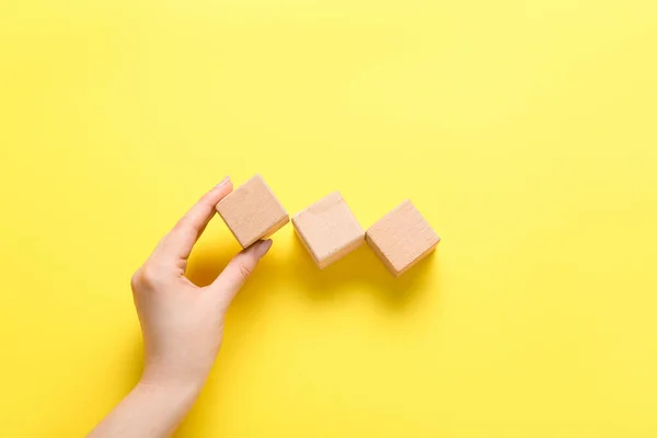 Hand Wooden Cubes Yellow Background — Stock Photo, Image