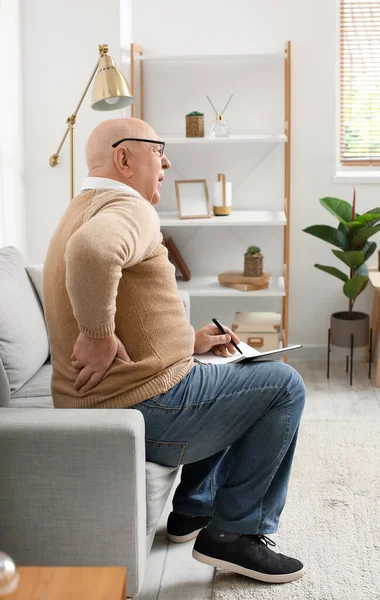 Senior Man Notebook Suffering Back Pain Sofa Home — Stock Photo, Image