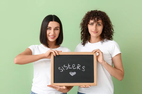 Beautiful Women Holding Board Word Sisters Color Background — Stock Photo, Image