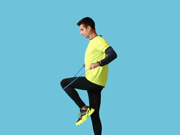 Sporty Young Man Jumping Rope Color Background — Stock Photo, Image