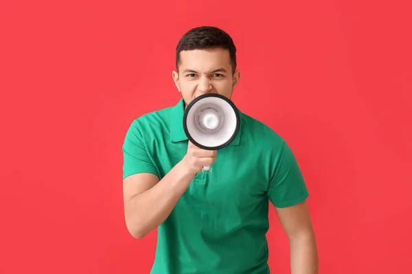 Angry Young Man Shouting Megaphone Red Background — Stock Photo, Image