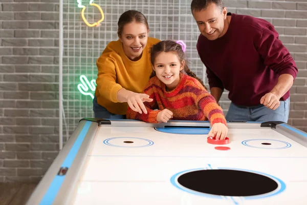 Family Playing Air Hockey Indoors — Stock Photo, Image