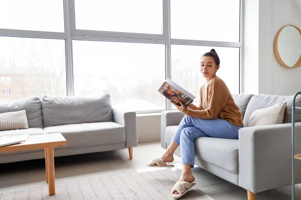 Beautiful Young Woman Reading Magazine Couch Home — Stock Photo, Image