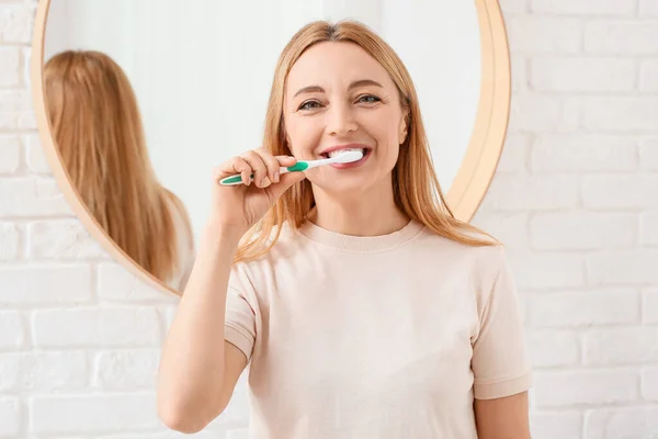 Beautiful Mature Woman Brushing Teeth Bathroom — Stock Photo, Image