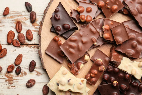 Board Pieces Tasty Chocolate Nuts Table — Stock Photo, Image