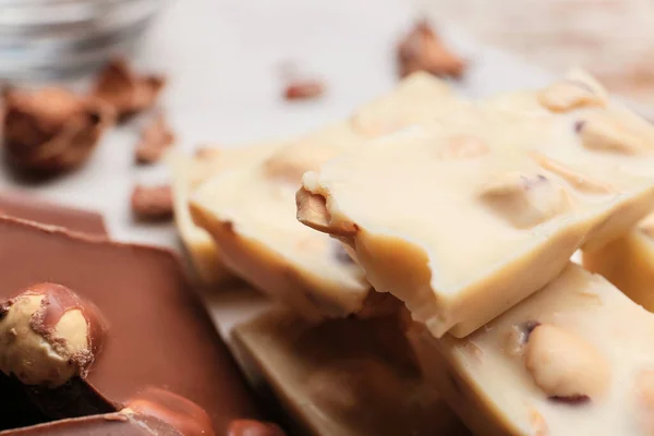 Pieces Tasty Chocolate Hazelnuts Closeup — Stock Photo, Image
