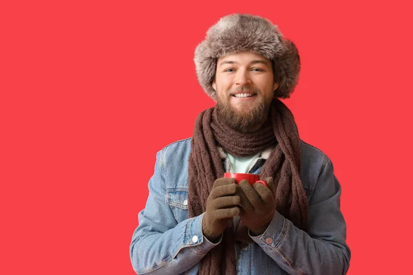 Young Bearded Man Warm Gloves Cup Cocoa Red Background — Stock Photo, Image