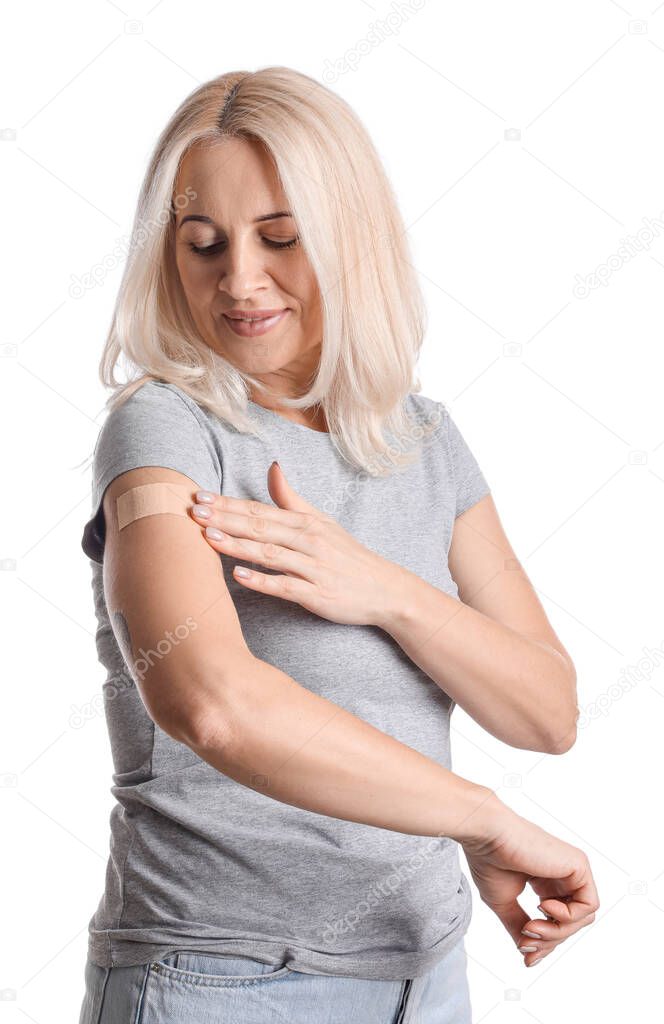 Mature woman with applied nicotine patch on white background. Smoking cessation