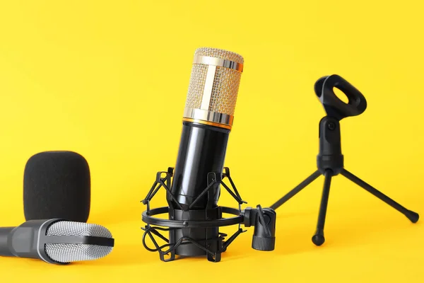 Modern Microphones Stands Yellow Background — Stock Photo, Image