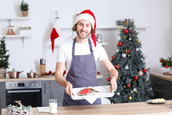 Young Man Santa Hat Holding Tray Christmas Cookies Home — Stock Photo, Image