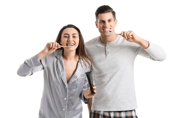 Junges Paar Beim Zähneputzen Mit Aktivkohle Zahnpasta Auf Weißem Hintergrund — Stockfoto