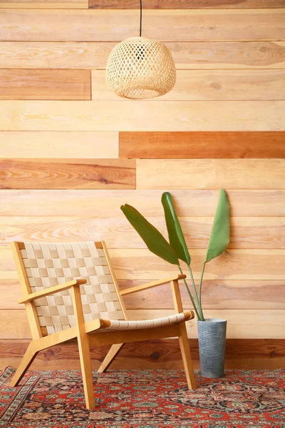 Armchair Vase Palm Leaves Vintage Carpet Wooden Wall — Stock Photo, Image