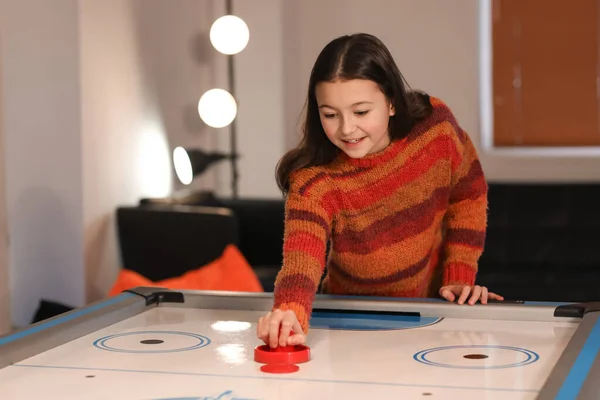 Cute Little Girl Playing Air Hockey Indoors — Stock Photo, Image