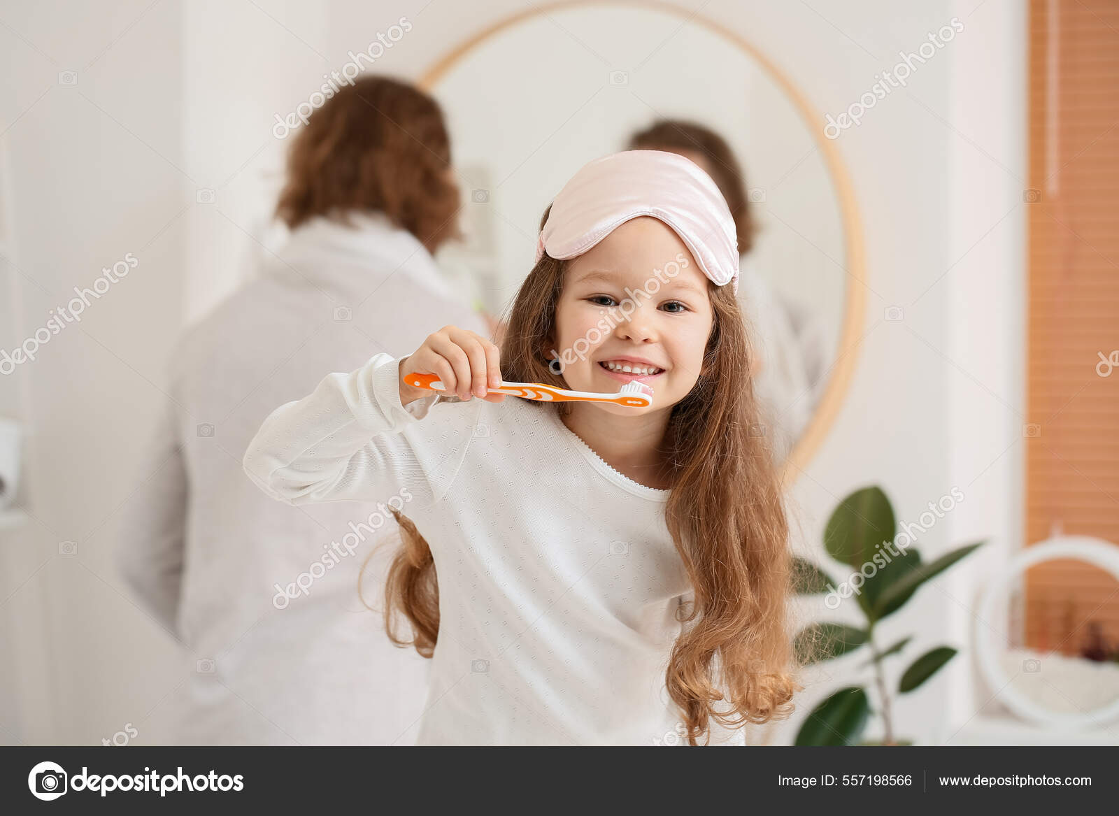 Little Girl Sleeping Mask Brushing Teeth Bathroom Stock Photo by