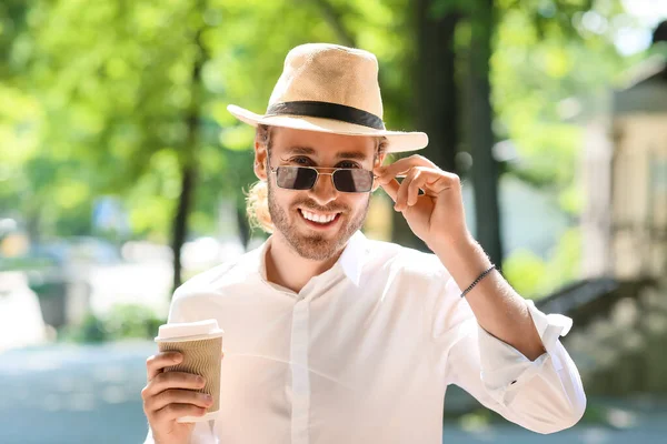 Handsome Young Man Drinking Coffee Outdoors — Stock Photo, Image