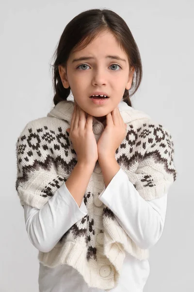 Sad Little Girl Suffering Sore Throat Light Background — Stock Photo, Image