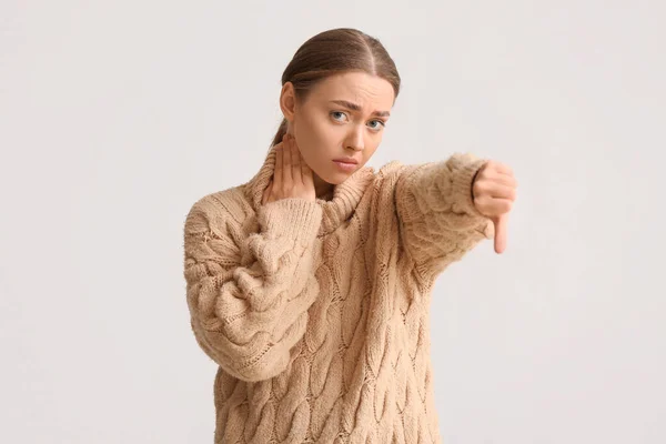 Ill Young Woman Sore Throat Showing Thumb Light Background — Stock Photo, Image