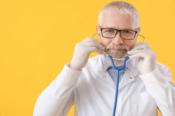 Mature Male Doctor Eyeglasses Stethoscope Yellow Background — Stock Photo, Image