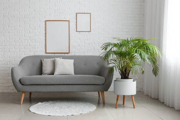 Interior Room Comfortable Sofa Houseplant Blank Photo Frames White Brick — Stock Photo, Image